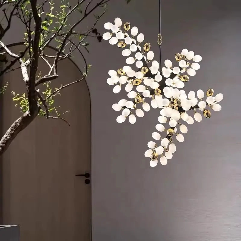 Vynelle chandelier with black and French gold egg-shaped glass design creating warm ambient luxury lighting