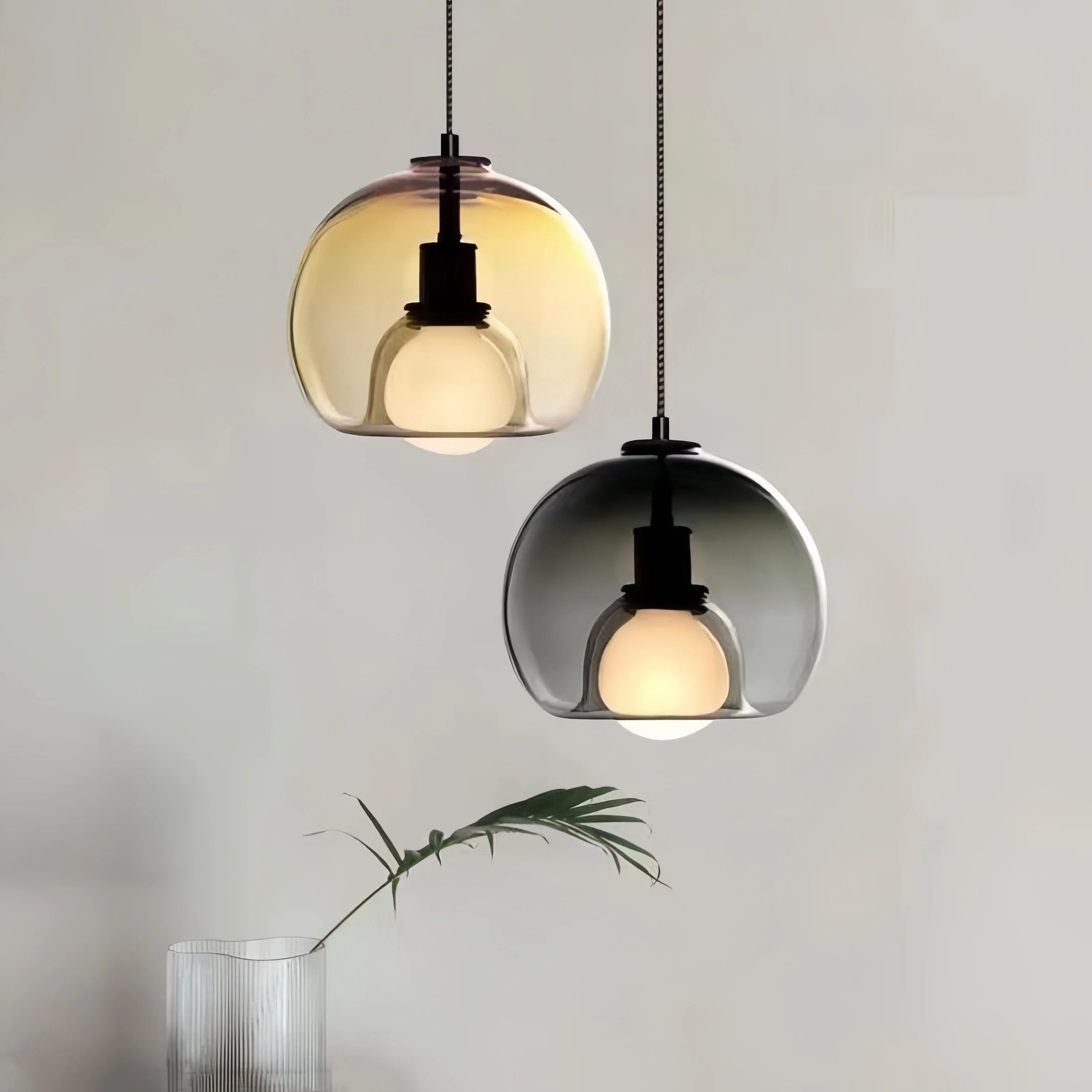 Orbis pendant light with Nordic-inspired glass design casting warm ambient glow for modern interiors
